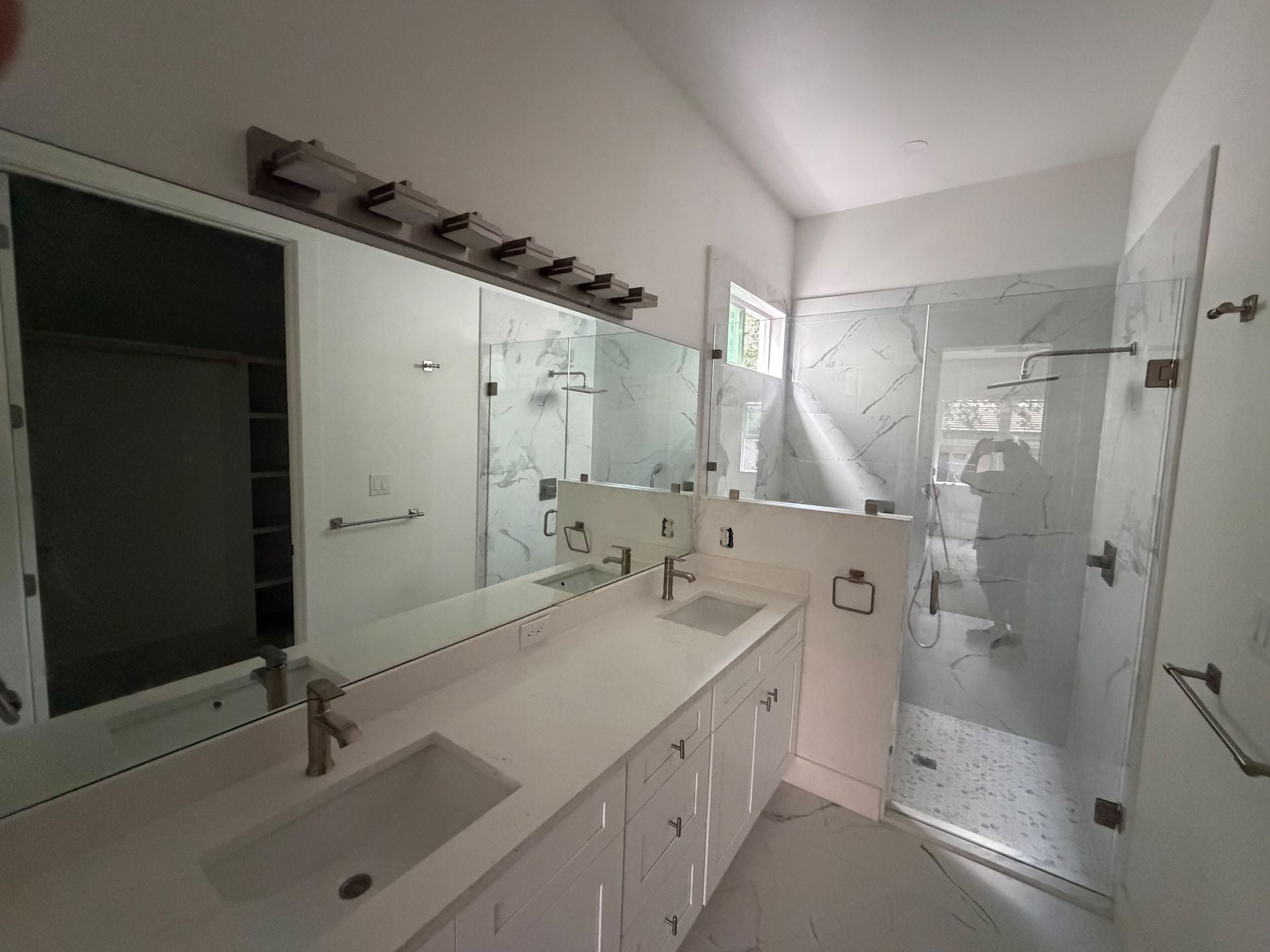 Custom mirror and frameless shower glass